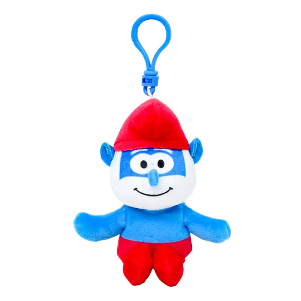 Smurfs Papa Smurf plush clip in bright blue soft fabric, with white beard, red pointed hat and pants, smiling face and outstretched arms, hanging from a blue plastic hook on white.