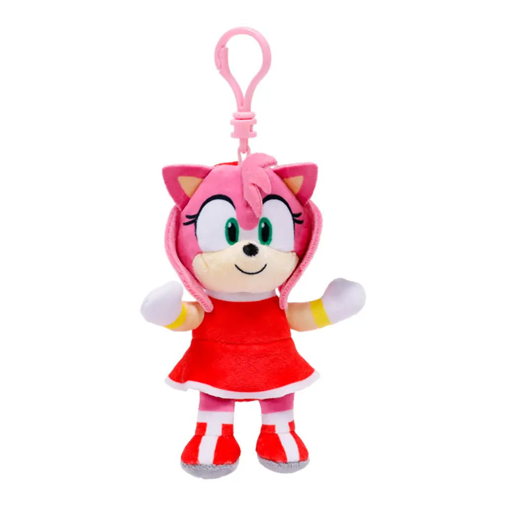 Pink Sonic the Hedgehog Amy plush clip features soft fabric, green eyes, a red dress, white gloves, striped boots, and a pink hanging loop on a white background.