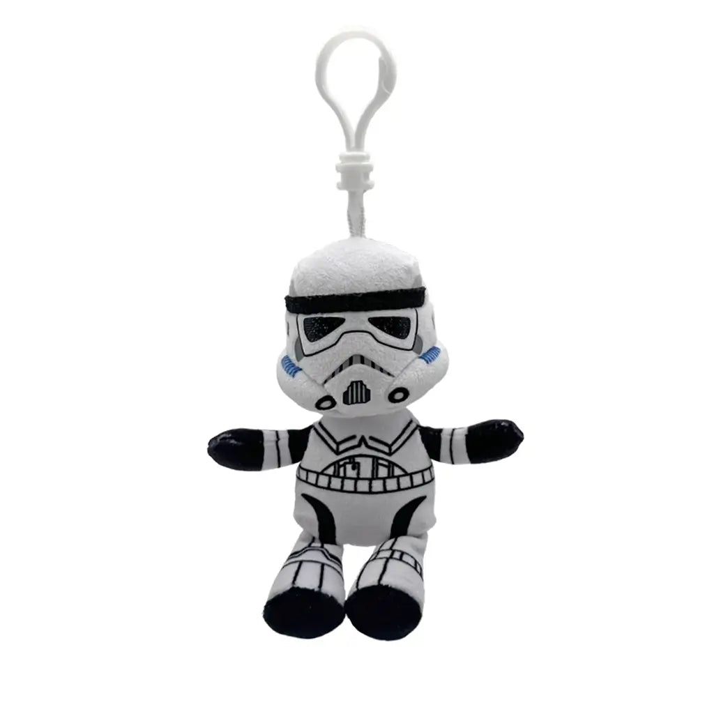 Star Wars Stormtrooper plush clip in white and black soft fabric, with armored helmet, chest and belt details, black gloves and boots, hanging from a white plastic hook on white.