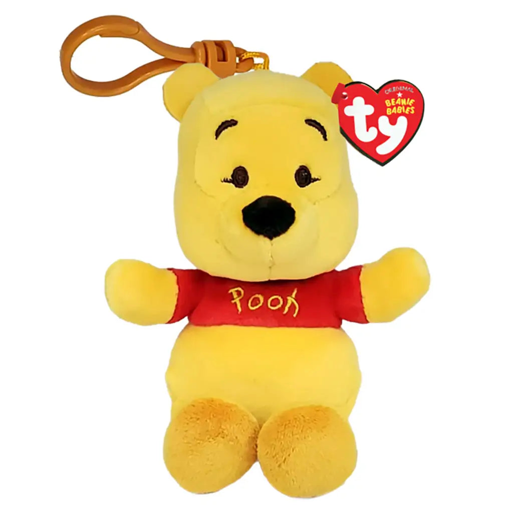 Winnie the Pooh plush clip in yellow soft fabric, with rounded bear shape, red Pooh shirt, embroidered face and brown plastic hook, displayed with a TY Beanie Babies tag on white.