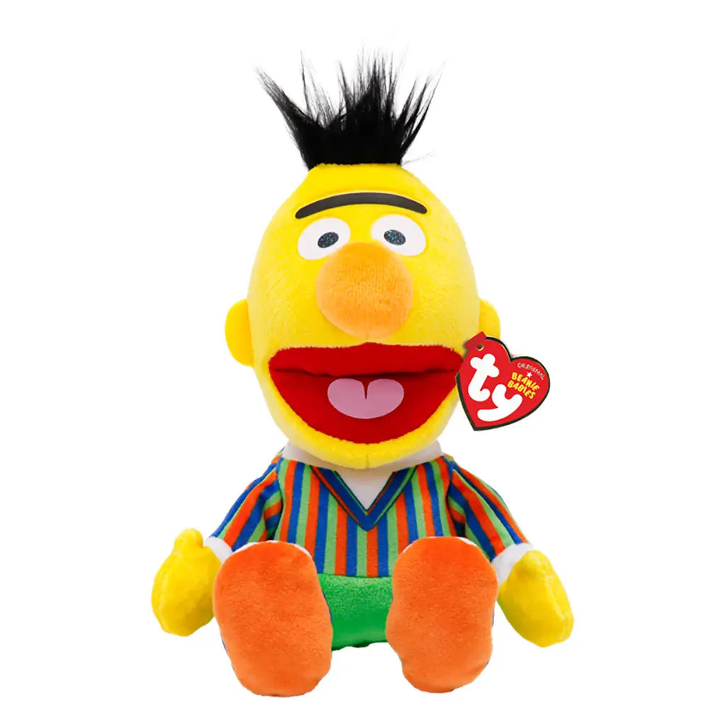 Sesame Street Bert plush toy in yellow soft fabric with black fuzzy hair, orange nose and feet, a striped shirt, green pants, and red Ty Beanie Babies tag on white.