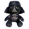 Star Wars Darth Vader plush toy in black soft fabric, with a rounded helmet, gray mask details, chest control panel and cape, seated against a clean white background.