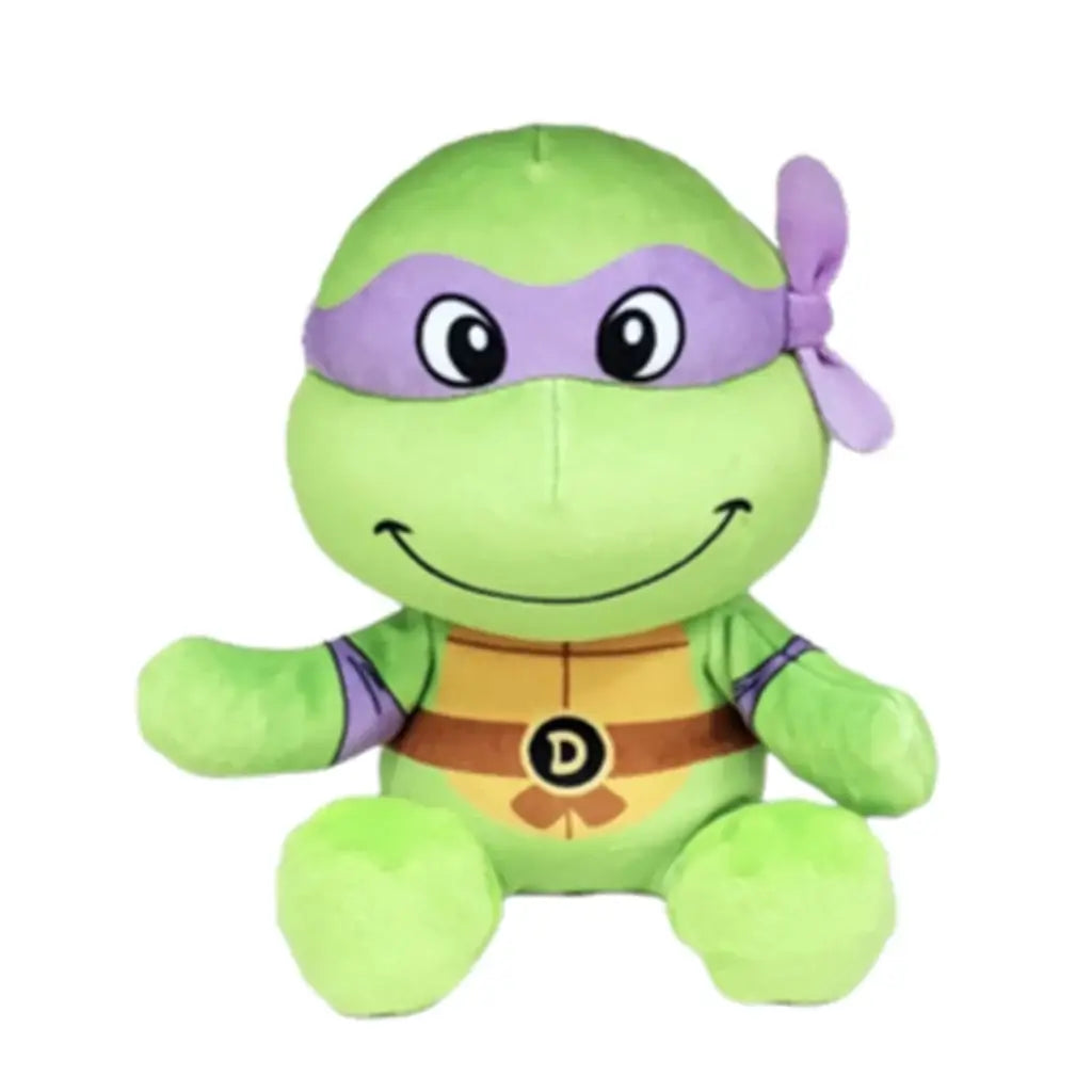 Donatello TMNT plush toy in bright green soft fabric, with a purple eye mask, tan shell chest, brown belt and D emblem, seated with open arms on a plain white background.