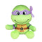 Donatello TMNT plush toy in bright green soft fabric, with a purple eye mask, tan shell chest, brown belt and D emblem, seated with open arms on a plain white background.