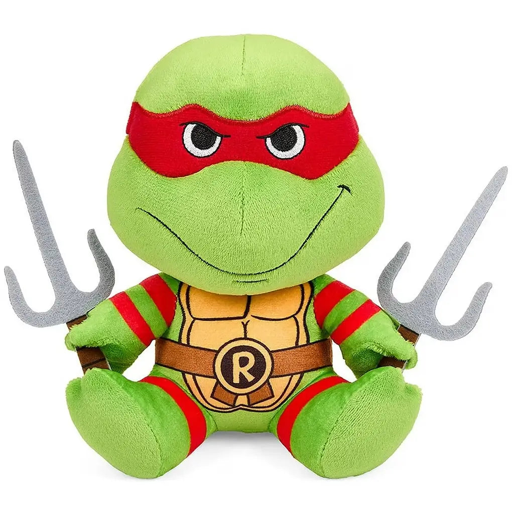 Teenage Mutant Ninja Turtles plush toy in bright green fabric features Raphael’s red eye mask, tan shell, brown R belt, and gray sai weapons on a clean white background.