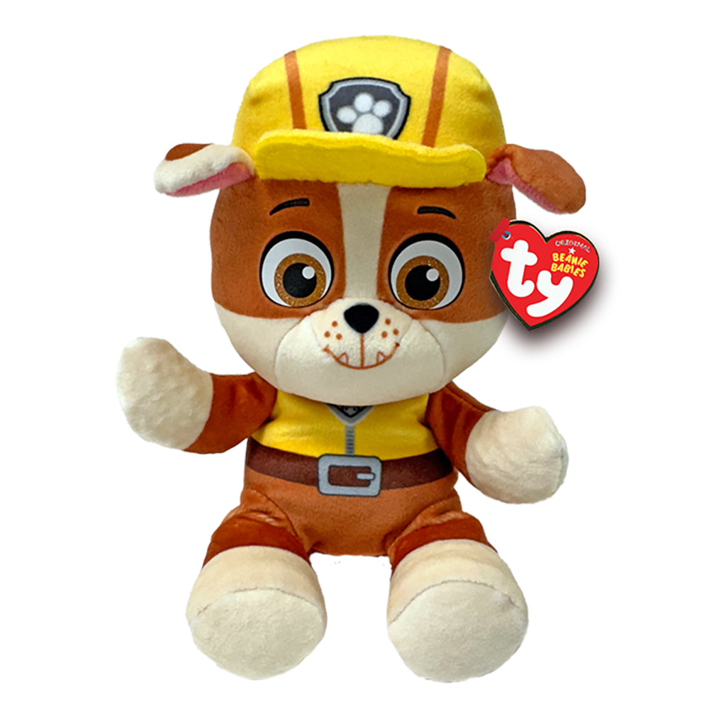 Paw Patrol Rubble plush toy in brown and cream soft fabric with rounded bulldog shape, wearing a yellow construction helmet and vest, featuring large brown eyes and floppy ears, on a white background.