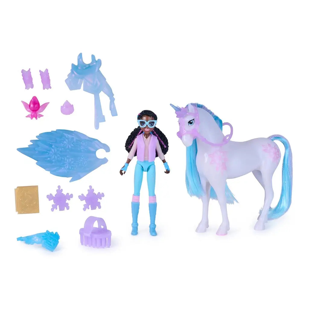 Unicorn Academy toy set contents arranged on white background, featuring pastel plastic unicorn, articulated Layla doll, translucent blue wings, gemstone accessories, and styling pieces designed for imaginative fantasy play.