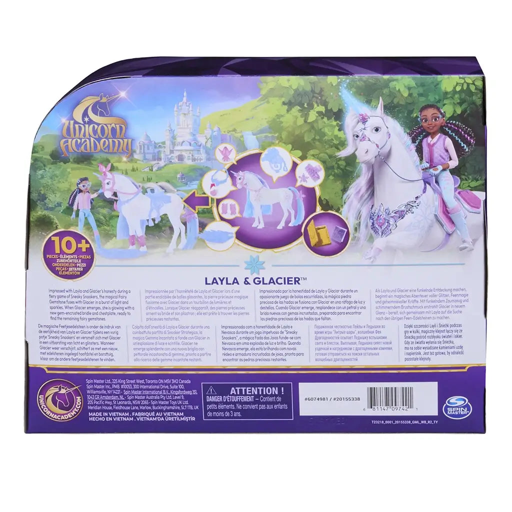 Unicorn Academy playset package back showing illustrated scenes, icons, and instructions on glossy purple cardboard, explaining features, accessories, and imaginative play scenarios set in a fantasy academy world.