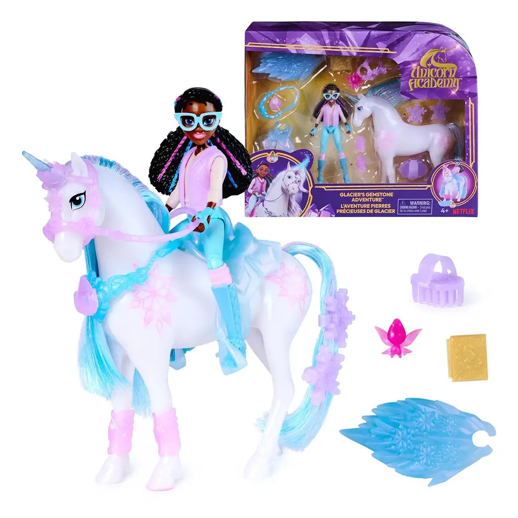 Unicorn Academy playset package showing purple cardboard box with clear plastic window, glossy printed graphics, and fantasy unicorn theme, displaying Layla figure and Glacier unicorn toy inside against a white background.
