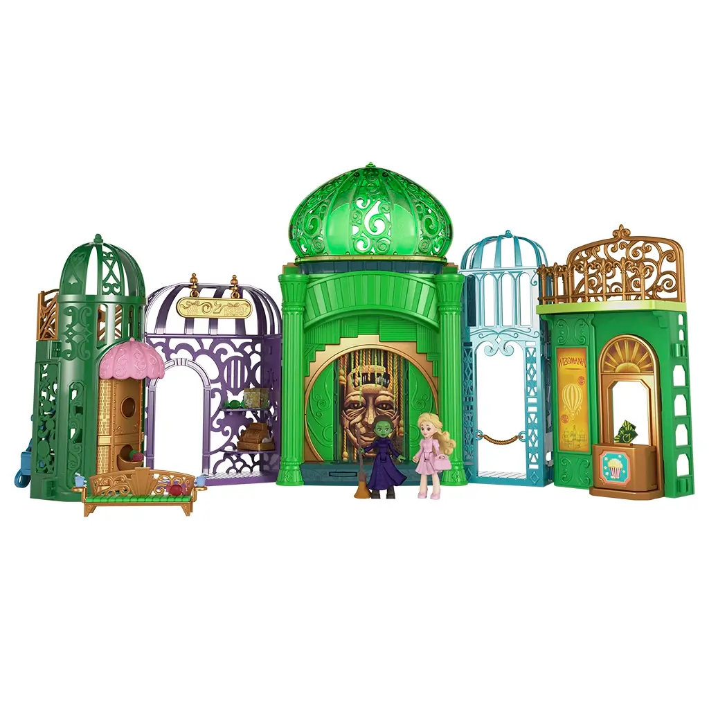 Wicked Emerald City playset featuring green and gold molded plastic buildings with ornate arches, domed rooftops, and fantasy city details, inspired by Universal Pictures Wicked and designed for small doll storytelling play.