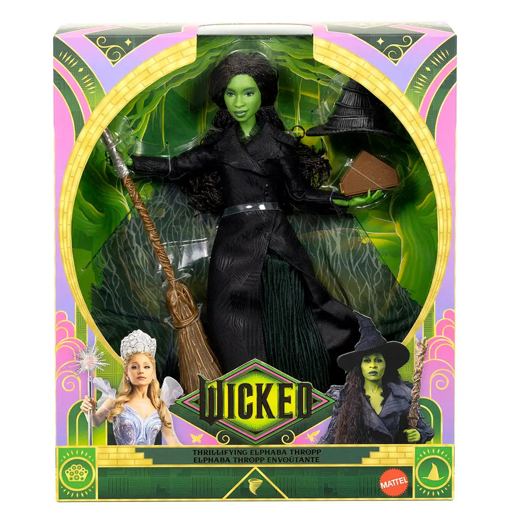 Wicked Elphaba Thropp deluxe doll packaging features green, pink, and gold cardboard with glossy finish, arched window display, Wicked branding, and Mattel logo, clearly presenting the Elphaba doll and accessories for retail shelves.