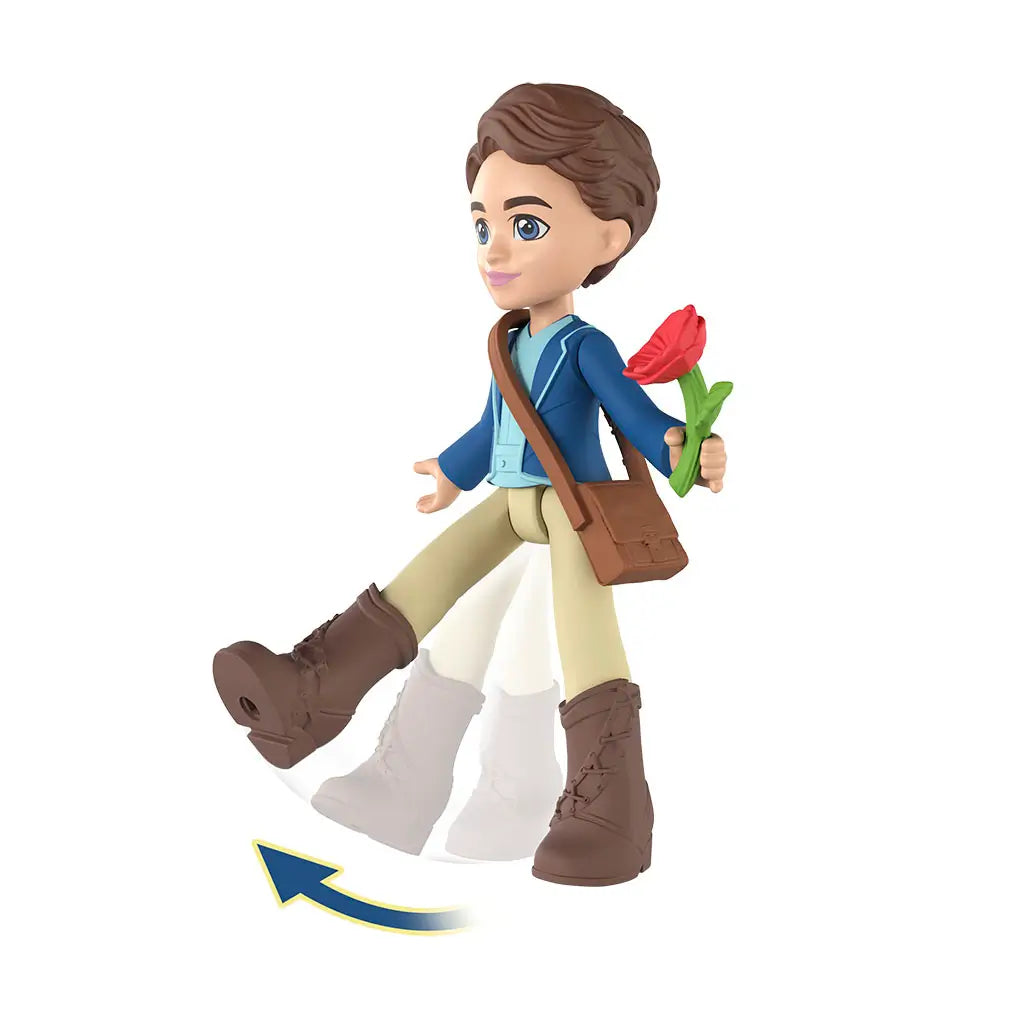 Universal Pictures Wicked mini doll shows articulated Fiyero figure mid-step with moving legs, blue jacket outfit, brown boots, shoulder bag, and red flower, demonstrating poseable play on white background.
