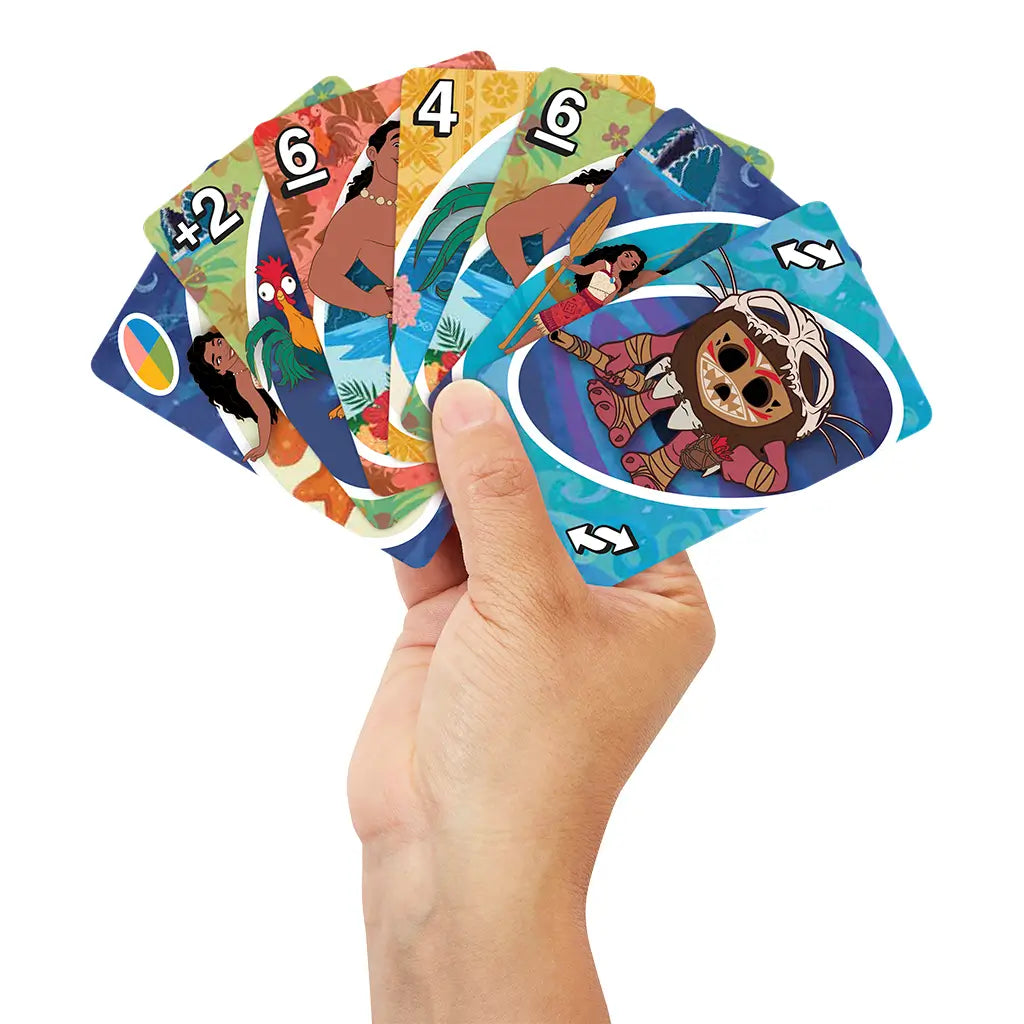 Hand holding Disney Moana 2 UNO cards shows colorful designs of Moana, Maui, Hei Hei, and Tamatoa with bright tropical colors, demonstrating gameplay and family fun theme.