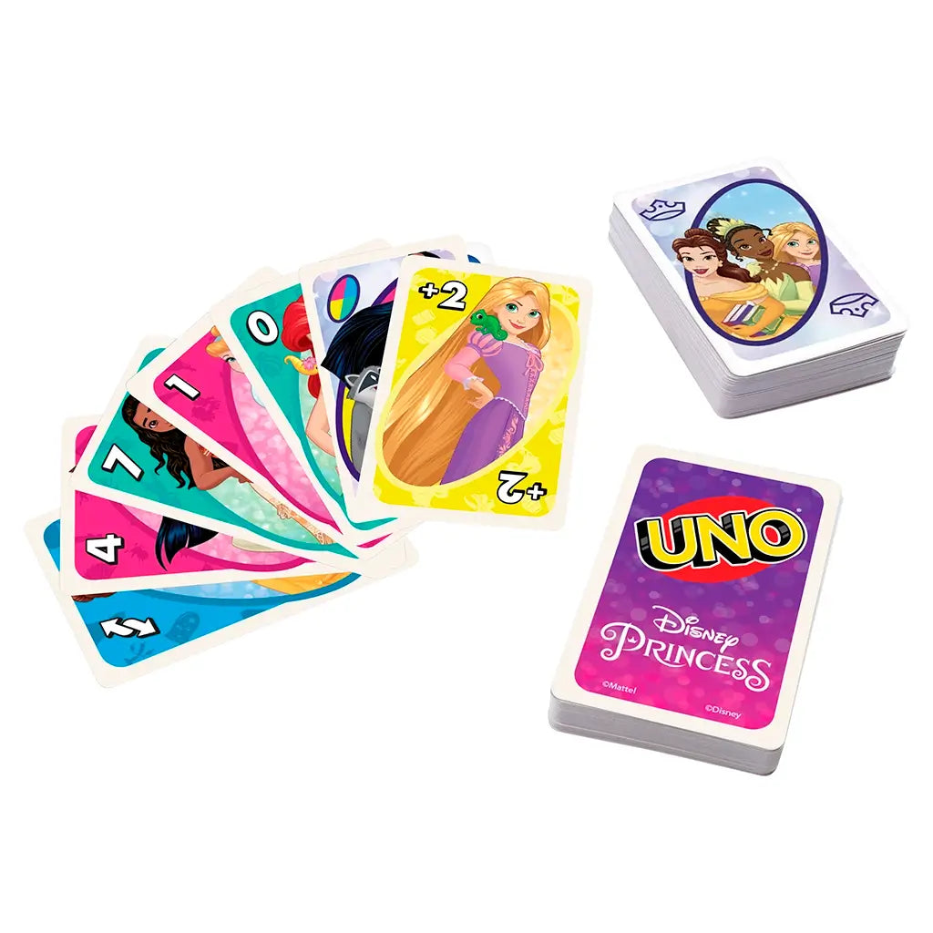 Disney Princess UNO cards spread across a white surface, showing Rapunzel, Pocahontas, and Jasmine alongside stacked decks with purple Disney Princess backs and group illustration cards.