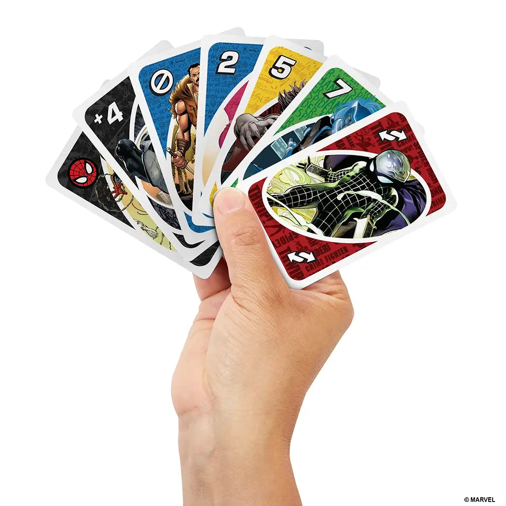 Hand holding fanned-out Marvel Spider-Man UNO cards featuring characters like Venom, Kraven, and Mysterio with vibrant backgrounds, showcasing action-packed comic artwork.