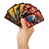 Hand holding UNO Yellowstone cards fanned out, featuring series characters, ranch brand icons, and classic UNO action symbols with rustic wood-style card borders.