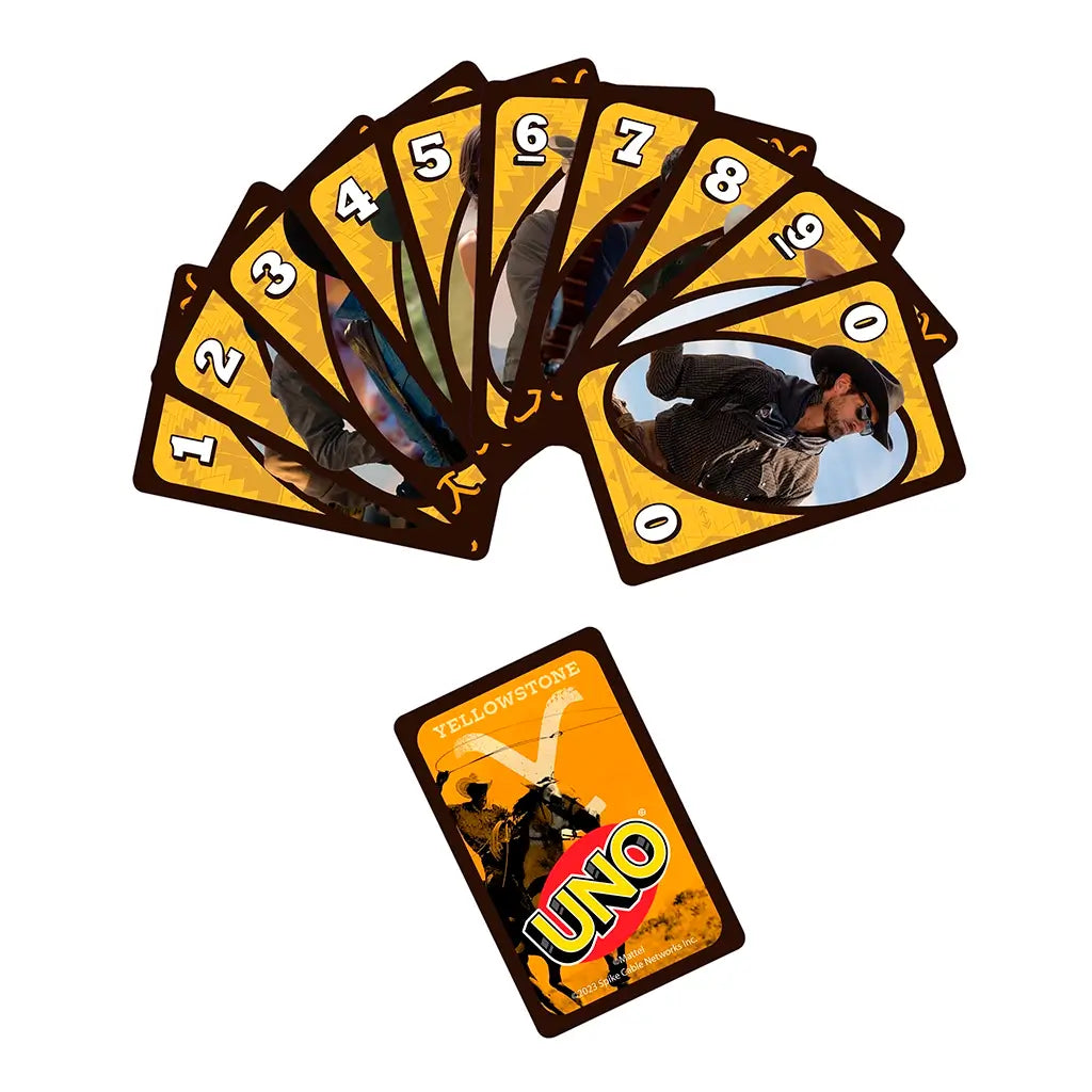 Fan of UNO Yellowstone cards spread out, showcasing numbered and action cards with series characters and rustic western designs, alongside signature UNO backs.
