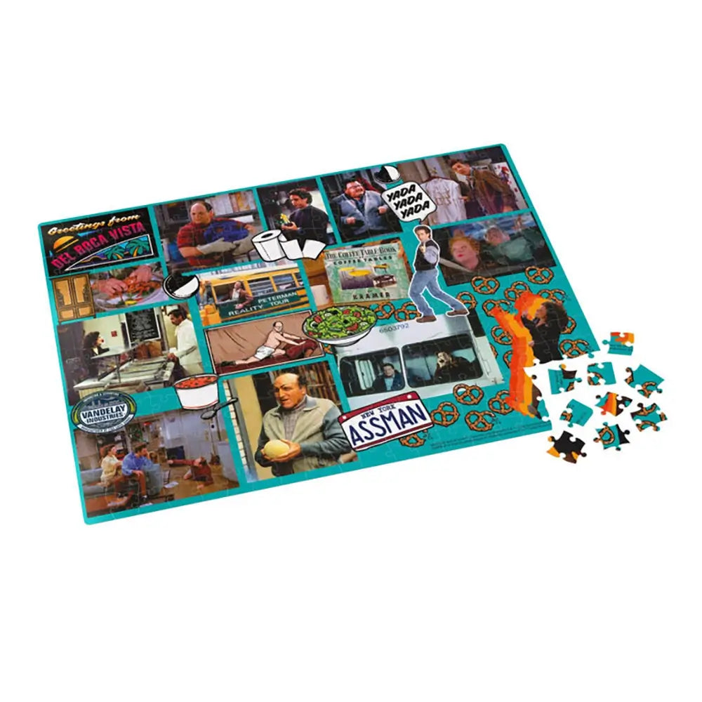 Seinfeld jigsaw puzzle in teal and multicolor printed cardboard pieces, flat rectangular layout, partially assembled with loose pieces, featuring iconic sitcom scenes on a plain white studio background.