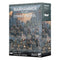 Warhammer 40,000 Astra Militarum Combat Patrol box shows gray and blue matte cardboard packaging, rectangular in form, featuring Citadel infantry and cavalry miniatures for tabletop wargaming, arranged on rocky terrain within a ruined futuristic city battlefield.