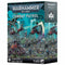 Warhammer 40,000 Combat Patrol Harlequins box, showing 11 colorful Eldar miniatures with dynamic poses on jetbikes and foot, set in a mystical forest battlefield with alien ruins and glowing green tones.