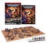 Warhammer 40K introductory set features blue Space Marines and green Orks, six Citadel paints, dice, terrain, and a gaming mat arranged beneath the English retail box.