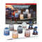 Warhammer 40K Space Marines Intercessors starter set with two blue Citadel miniatures, six assorted paint pots, and a starter brush displayed with the retail box.