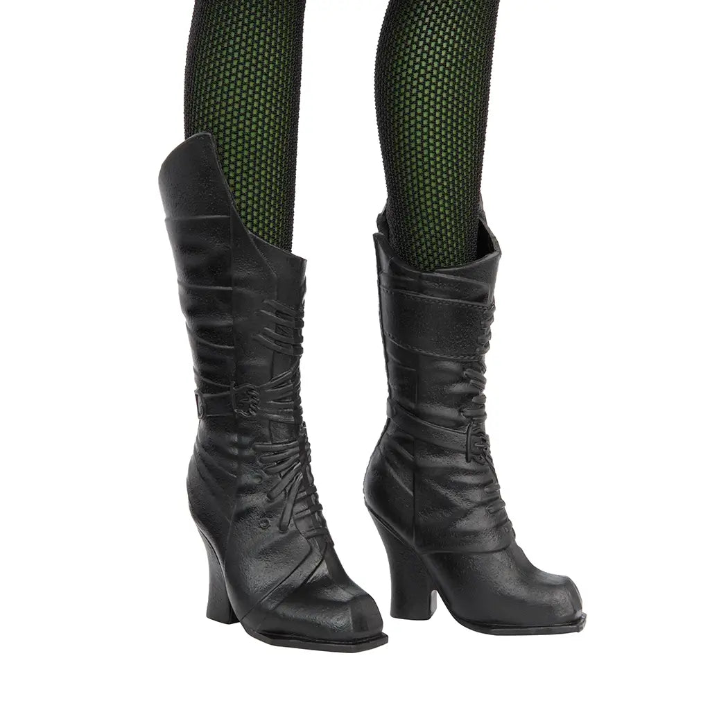 Close-up of Wicked Elphaba doll's black lace-up boots with pointed toes, textured leather-like finish, and green fishnet tights underneath.