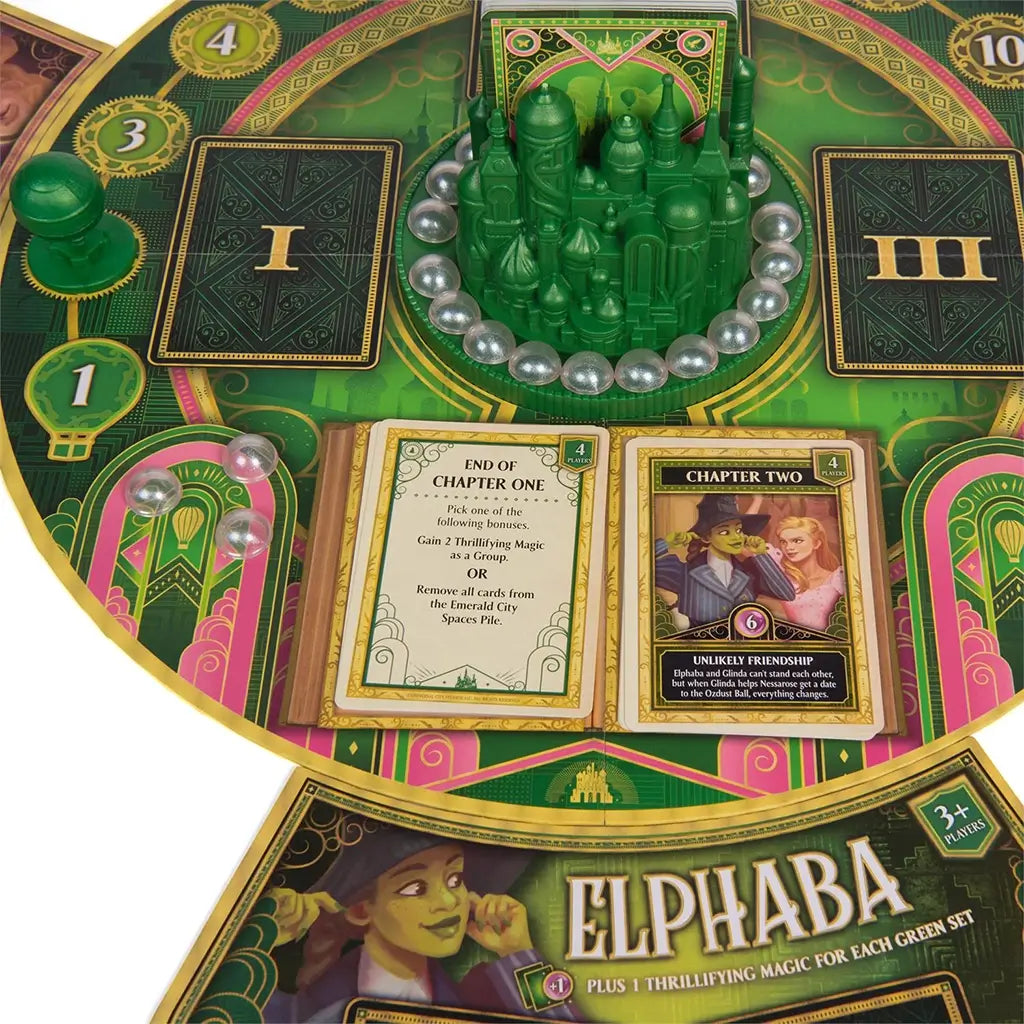 Close-up view of the Wicked board showing open storybook-style chapter cards and the Elphaba player mat, revealing intricate design and narrative elements.