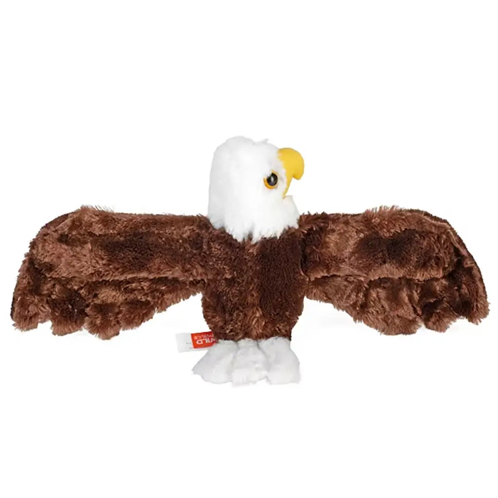 Wild Republic bald eagle plush toy in brown and white soft fabric with plush texture, rear view showing wide wingspan and rounded body, soft stuffed construction made for hugging and gentle play.