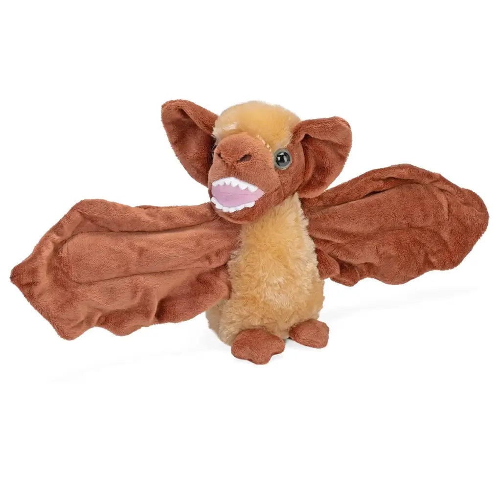 Wild Republic bat plush hugger with warm brown and tan polyester fur, wide fabric wings, rounded upright body, and glow in the dark eyes, designed as a wraparound cuddly toy on a clean white background.