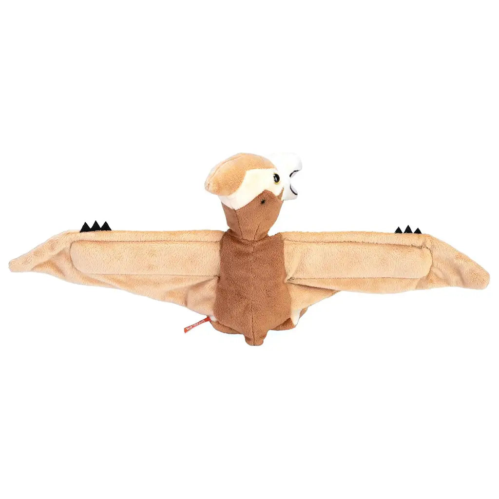 Wild Republic pteranodon plush toy in tan and cream colors with soft fabric texture, angled pose with extended wings and smiling beak, lightweight stuffed design intended as a wraparound huggable dinosaur plush.