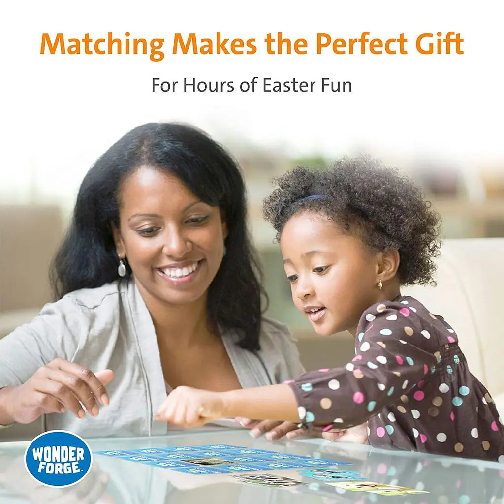 A mother and daughter smiling while playing Wonder Forge Americana Matching Game together at a glass table, enjoying the family-friendly activity with bright blue tiles.
