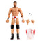 WWE Elite Collection LA Knight wrestling figure displayed in tan and white plastic with muscular sculpted torso, black knee pads and boots, red logo trunks, interchangeable hands, sunglasses, and removable vest on a clean white studio background.
