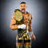 Detailed close-up of WWE Elite Bron Breakker figure in yellow tiger-striped singlet holding gold championship belt, showing muscular sculpt, lifelike facial expression, and black wrist tape details.