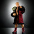WWE Elite Collection Ilja Dragunov action figure in red patterned robe with black fur trim, holding gold NXT championship belt, posed against dark studio background.