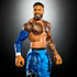 WWE Elite Collection Jey Uso action figure with realistic tattoos, blue pants, black boots, and lifelike sculpted beard, posed against a dark gradient studio background