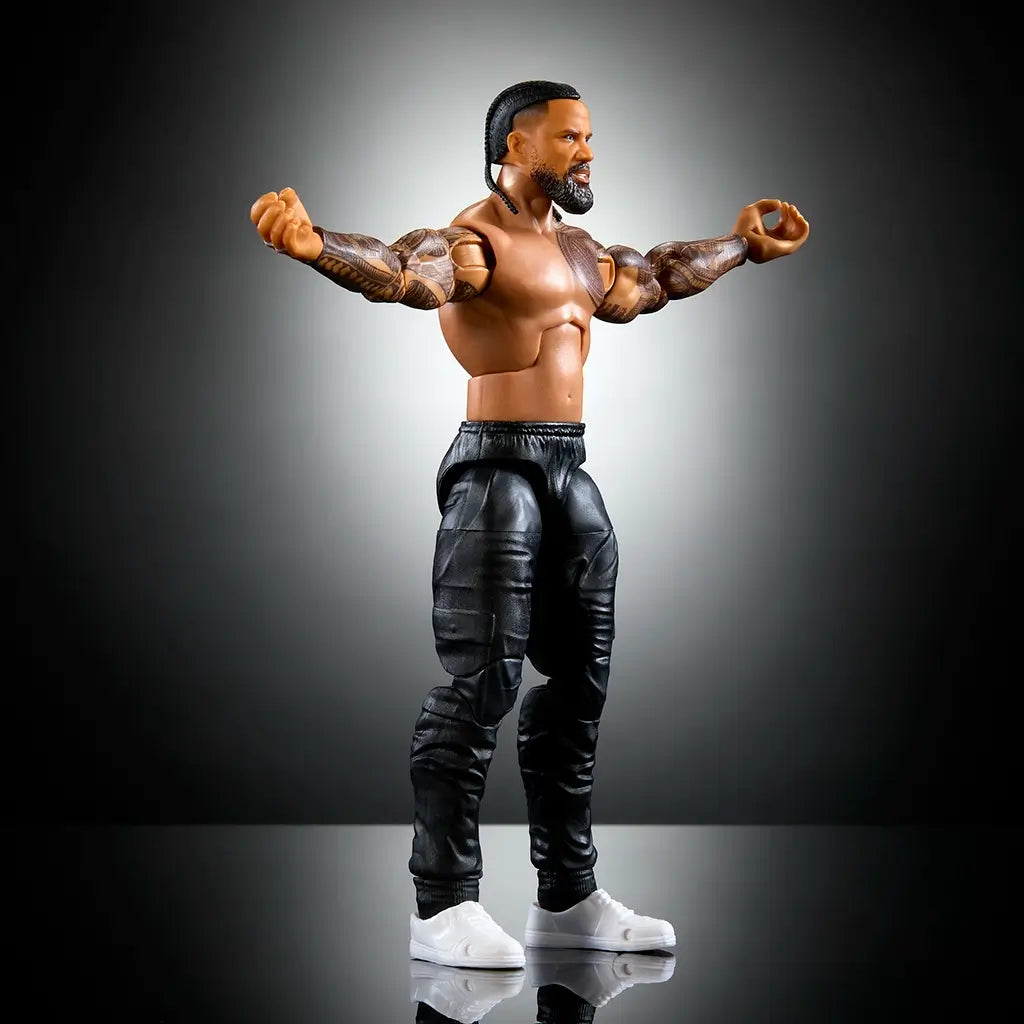 WWE Elite Jimmy Uso Series 114 figure demonstrates 25 points of articulation, muscular design, tattoo detailing, black pants, and removable accessories on display.