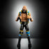 WWE Elite Tommaso Ciampa action figure with black and blue detailed entrance vest, muscular build, and lifelike beard sculpt displayed against a dark gradient background.