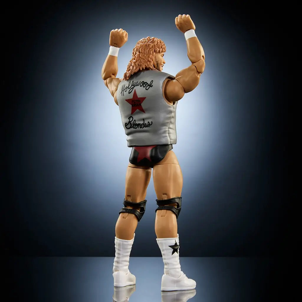 Rear view of WWE Elite Collection Brian Pillman Series 116 figure shows silver vest with red star and 
