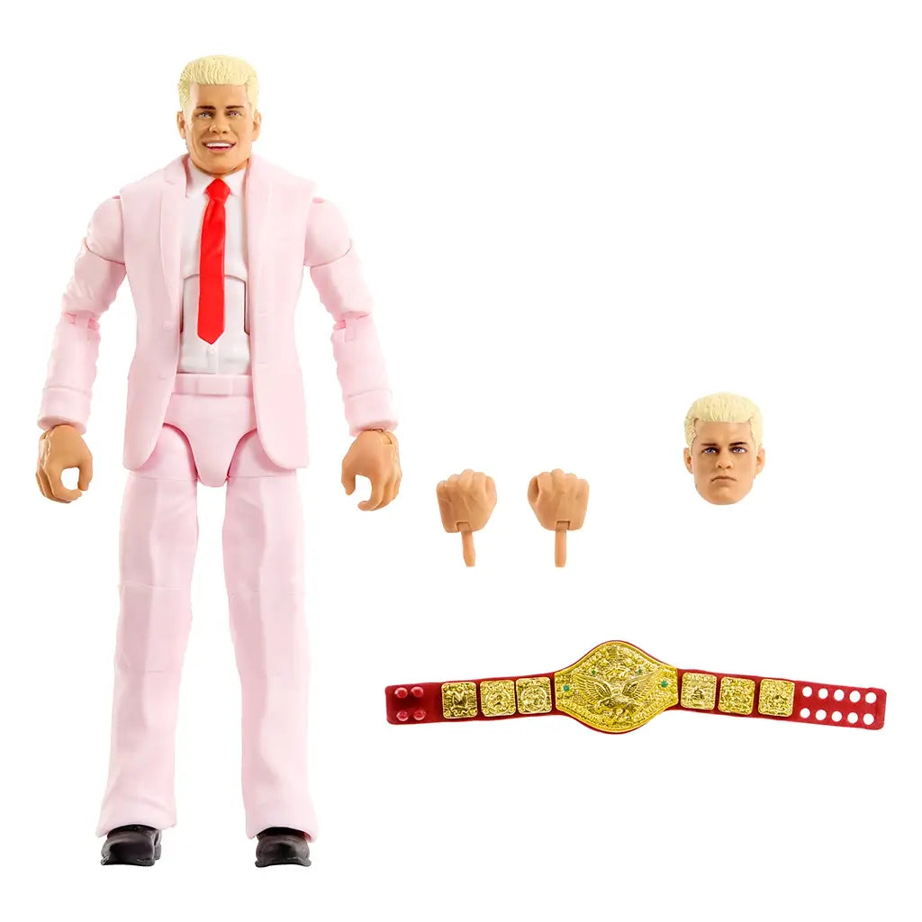 WWE Cody Rhodes Elite Collection action figure in light pink suit with smooth plastic texture, tailored jacket and pants, red necktie, blond molded hair, and black dress shoes, standing upright as a collectible wrestling figure on a clean white background.