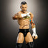 Close-up of WWE Elite CM Punk action figure showcasing muscular torso, colorful tattoos, taped fists with X markings, and realistic sculpt under studio lighting.