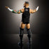 WWE Elite Collection CM Punk action figure in black boots and vest with tattooed arms extended, detailed rear view under dramatic studio lighting for collector display.