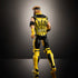 WWE Logan Paul action figure in black and yellow attire with removable vest, back view highlighting “Logan Paul” text design under dramatic spotlight.