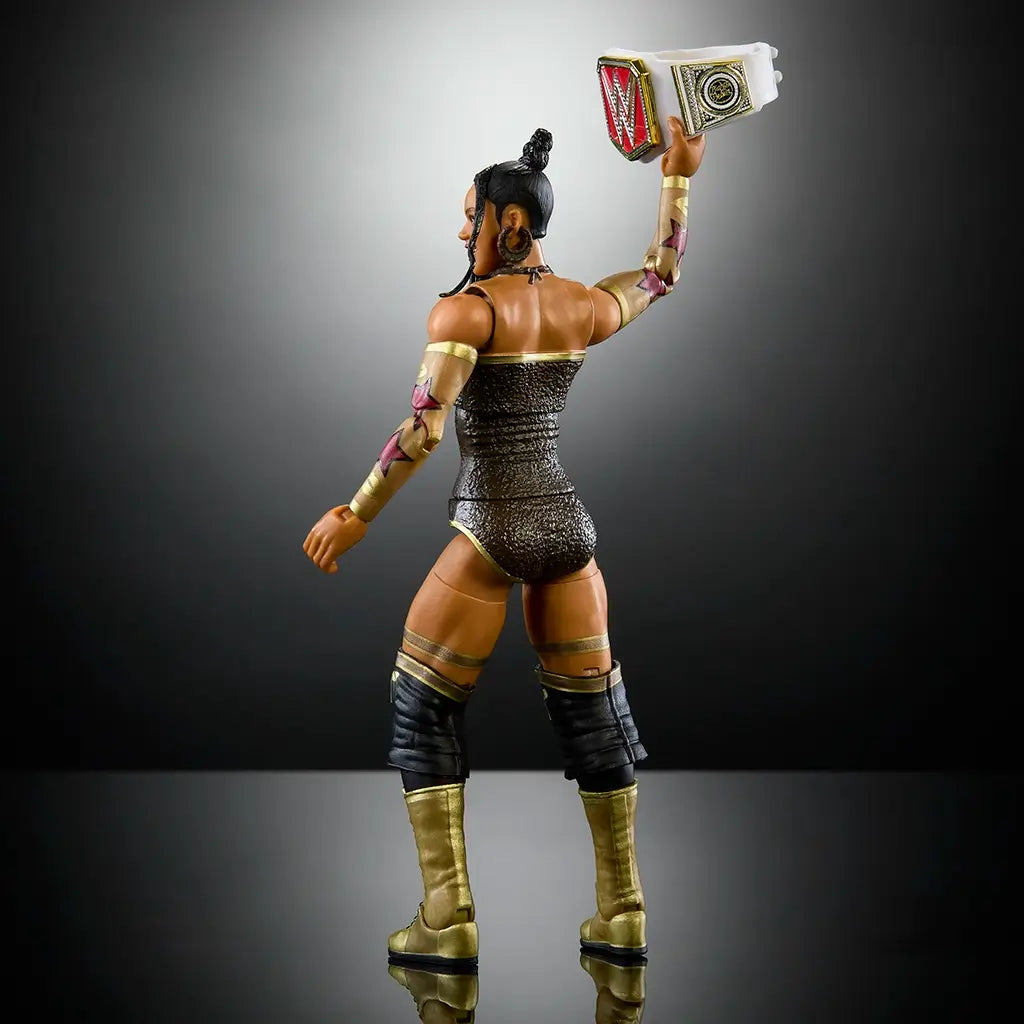 Rear angled view of Bianca Belair Elite Collection wrestling figure in glittering black attire, long braid, and gold boots holding WWE championship belt aloft in victory pose.