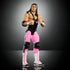 Full front view of WWE Elite Bret Hart action figure in black singlet, pink pants, black kneepads, and tall white lace-up boots with pink accents.