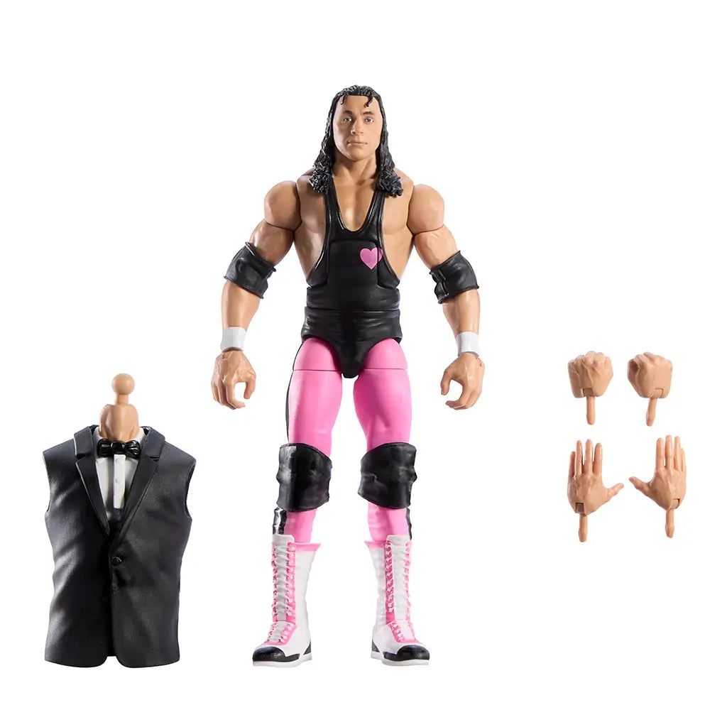 WWE Elite Bret Hart figure with interchangeable hands, black singlet, pink tights, white boots, and included Howard Finkel build-a-figure tuxedo vest accessory.