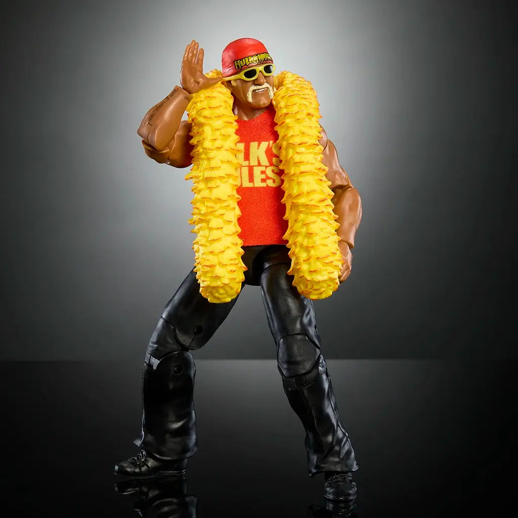 WWE Hulk Hogan wrestling figure posed with yellow feather boa, red Hulk’s Rules shirt, sunglasses, and black pants, hand-to-ear gesture iconic to his wrestling persona.