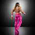 WWE Seth Rollins Elite Collection figure rear view showing muscular build, long hair with yellow tips, pink pants, and detailed articulation on a dark studio backdrop.