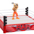 WWE Knuckle Crunchers Seth Rollins figure posed inside RAW rebound ring holding gray toy shovel overhead, showing interactive wrestling play action.