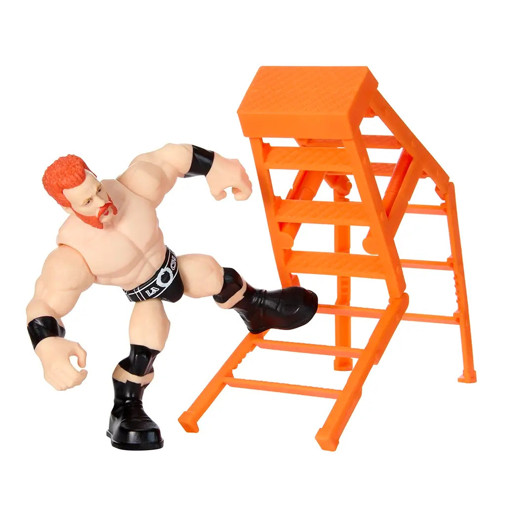 WWE Sheamus Knuckle Crunchers toy posed kicking orange ladder, featuring muscular arms, black boots, trunks, and wristbands designed for bending and wrestling play.